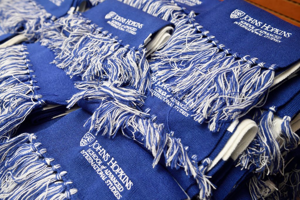 Scarf with SNF Agora logo on it